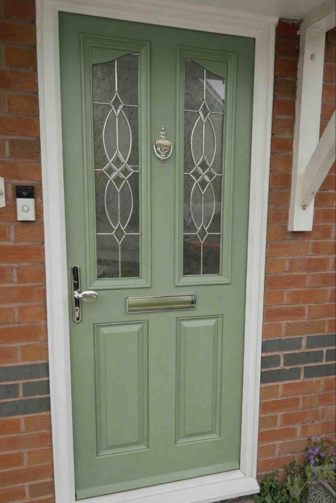 Composite front door freshly resprayed in a fresh sage green finish