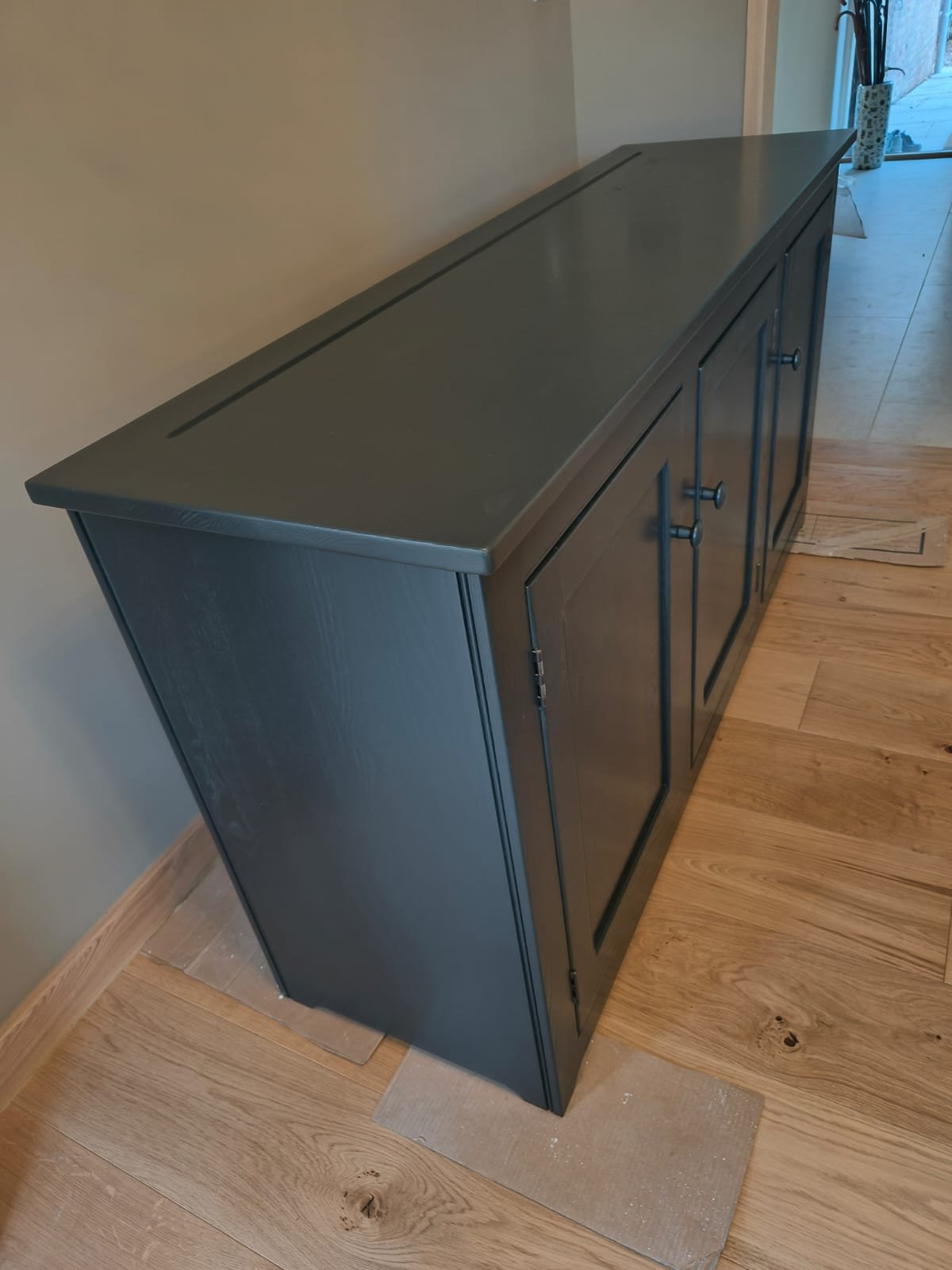 Solid wood sideboard hand-sprayed in a deep grey factory-grade finish